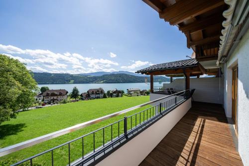 a balcony with a view of a lake at Haus Nowak Ferienwohnungen in Millstatt