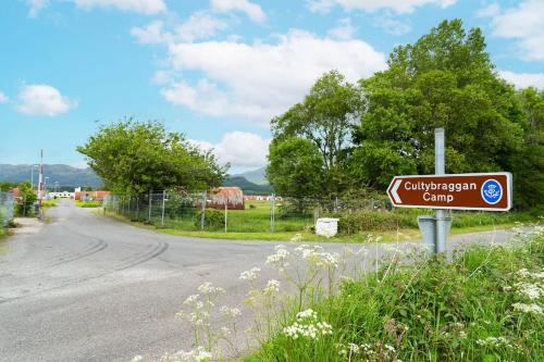 a street sign on the side of a road at Cultybraggan Hut 34 in Mill of Fortune