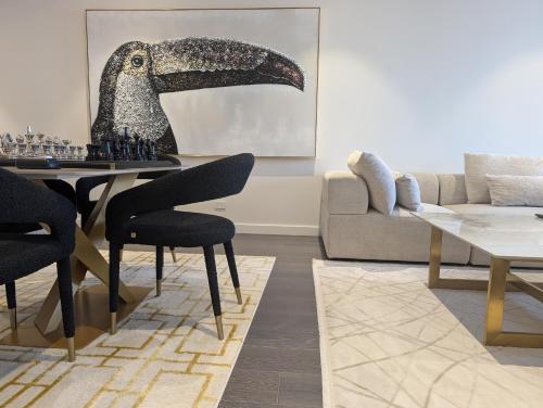 a living room with a table and a couch at Ultra Luxury 1BR with Study beside Crown Sydney, with All AMENITIES! And sleeps 5! in Sydney