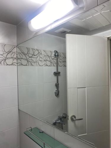 a bathroom with a mirror and a sink at Sweet House Incheon in Incheon