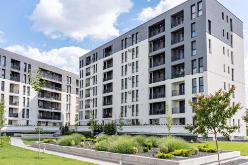 an image of two apartment buildings at Modern Apartment with Free Private Parking in Timisoara in Timişoara