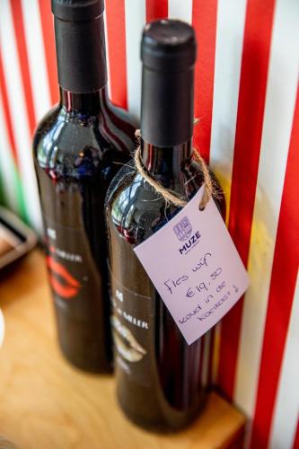 two bottles of wine sitting on top of a table at MUZE Hotel Utrecht in Utrecht