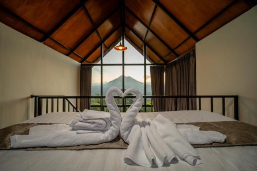 Payang Cabin Kintamaniにあるベッド