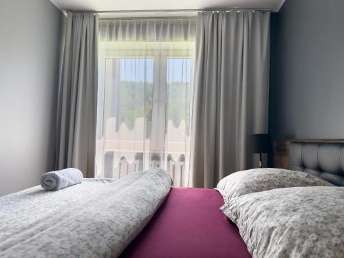 Ένα ή περισσότερα κρεβάτια σε δωμάτιο στο Apartament Górski z widokiem na góry w Bieszczadach - 3 sypialnie 80m2