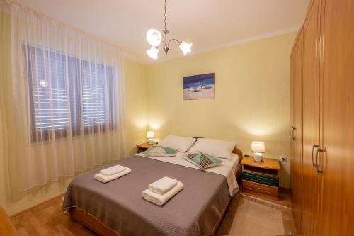Postel nebo postele na pokoji v ubytování Apartman Sabljak