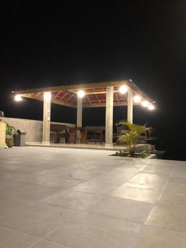 a pavilion at night with lights on it at Hariara Guest House in Tuk Tuk