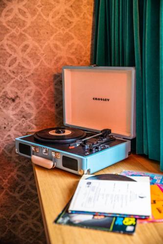 a laptop computer sitting on top of a table at MUZE Hotel Utrecht in Utrecht