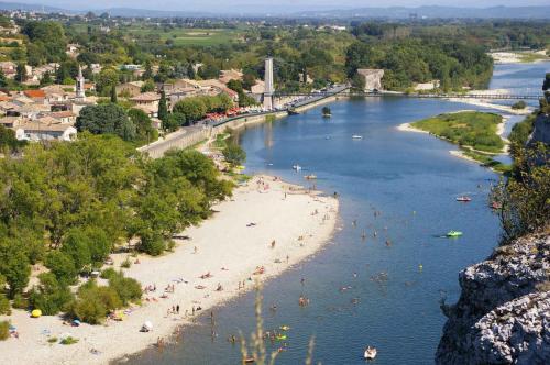 a group of people on a beach in a river at Maison de village confortable entièrement rénovée in Saint-Just