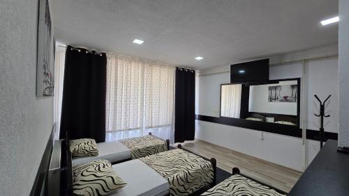 Postel nebo postele na pokoji v ubytování Champion APARTMAN Potoci M17