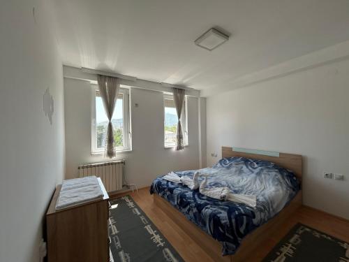 Postel nebo postele na pokoji v ubytování Nikolovi Apartment