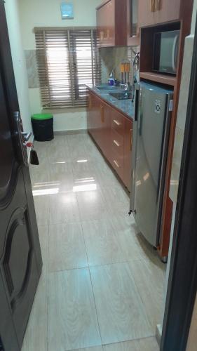 Η κουζίνα ή μικρή κουζίνα στο Cee-Jackson Apartments