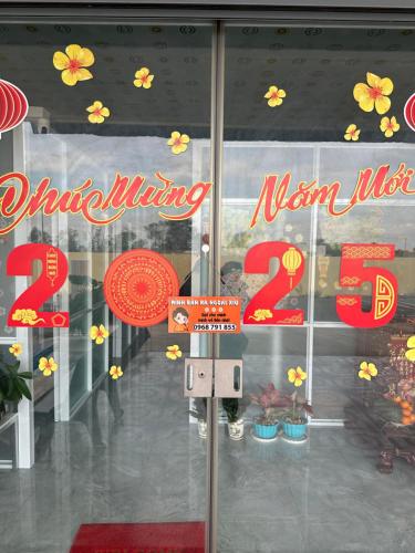 a window of a store with a sign on it at Bằng Lăng Tím in Ấp Bình Tú
