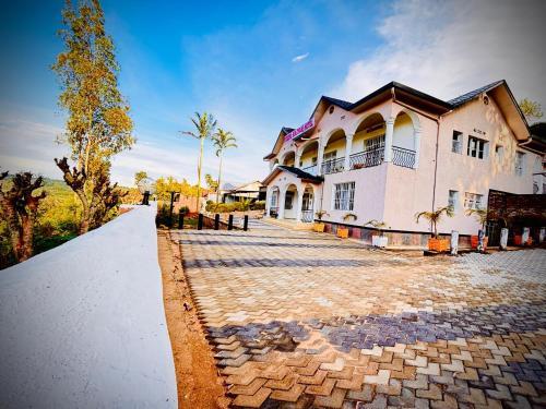 a large white house with a ramp in front of it at Irebero Boutique Hotel in Taba