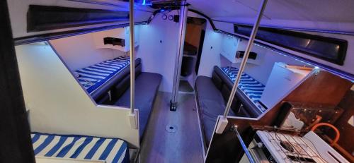 a view of a boat with two beds in it at Parque de Campismo Rural Quinta das Laranjeiras in Ribeira Grande