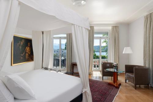 Postel nebo postele na pokoji v ubytování Grand Hotel Europe