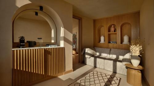 a living room with a couch and a table at Mamula Island by Banyan Tree in Herceg-Novi
