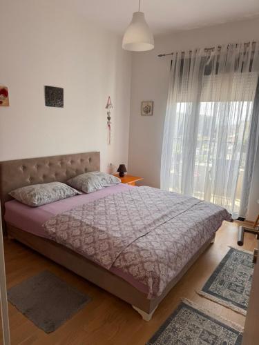 Ένα ή περισσότερα κρεβάτια σε δωμάτιο στο Flower and Love Flat Next to centar of podgorica