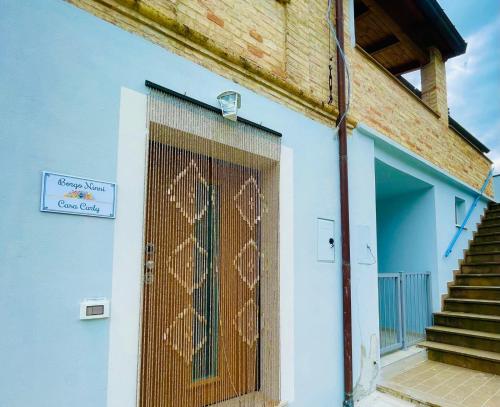 a door with a heart drawn on it on a building at Borgo Ninni - CASA CARLY in San Vito Chietino