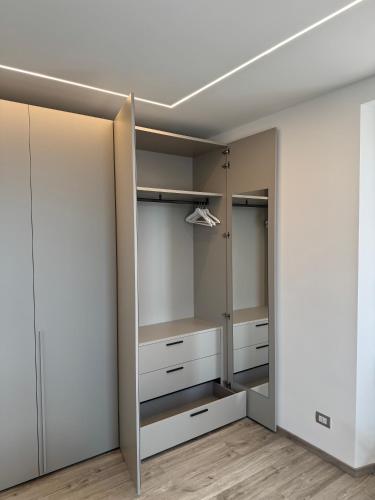 a walk in closet with white closets at B&B Ersilia in Eupilio