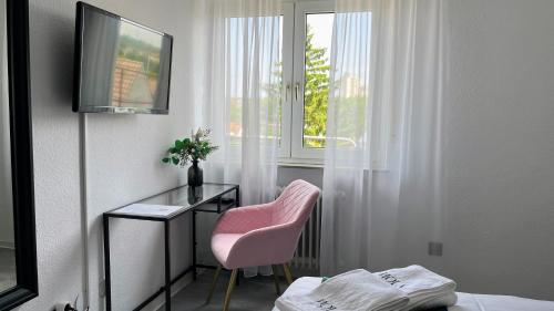 TV a/nebo společenská místnost v ubytování Hola Hotel Stuttgart