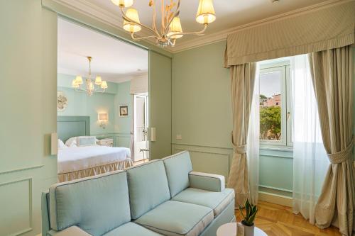a living room with a couch and a bed at Manzi Hotel & Spa in Ischia