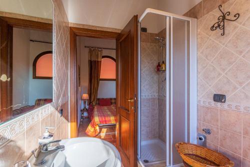 a bathroom with a sink and a shower at La Casa di Gelsomino in Massa Martana
