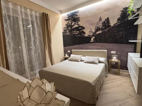 a bedroom with a bed and a painting on the wall at Saint Peter's Sunset View Luxury Apartment in Rome
