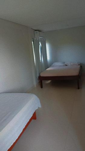 Ένα ή περισσότερα κρεβάτια σε δωμάτιο στο Casa Aconchegante