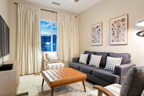 a living room with a couch and a table at Unbeatable Location Golden Condo - Walk Everywhere in Golden