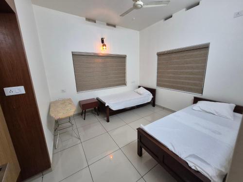 Katil atau katil-katil dalam bilik di Zainab Apartment