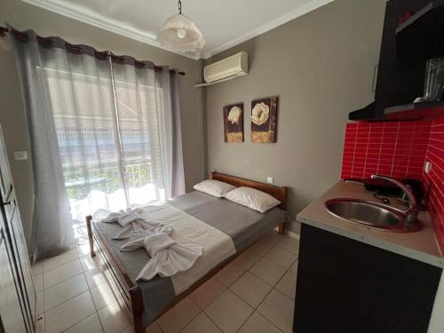 Postel nebo postele na pokoji v ubytování Nopi Rooms