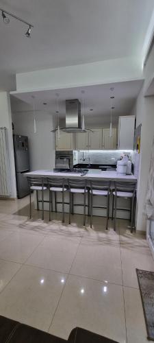 a large kitchen with a table and chairs in it at Aurora sul mare in Terracina