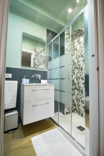 a bathroom with a sink and a mirror at ETNAGLOW Luxory Sicilian Villa in Nicolosi