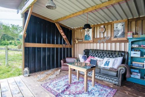 a living room with a couch and a table at Piggy in Pembroke