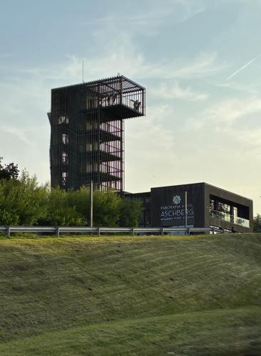 a tall building with a building in the background at FeWoHuett - Ferienhaus in den Hüttener Bergen in Brekendorf