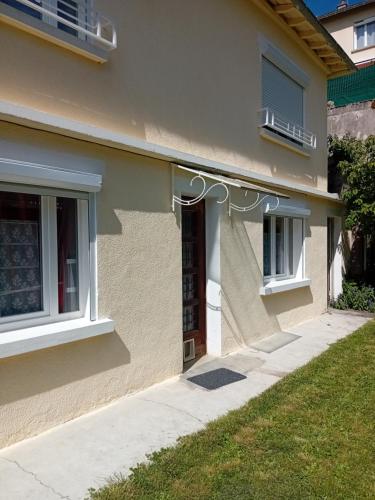 a front door of a house with a house at Studio les pivoines espace vert et terrasse in Saint-Alban-sur-Limagnole