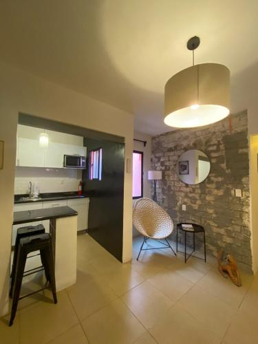 a kitchen with a table and chairs in a room at Cozy Flat Condesa in Mexico City