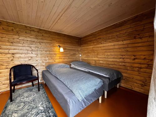 Postel nebo postele na pokoji v ubytování Mýrartunga