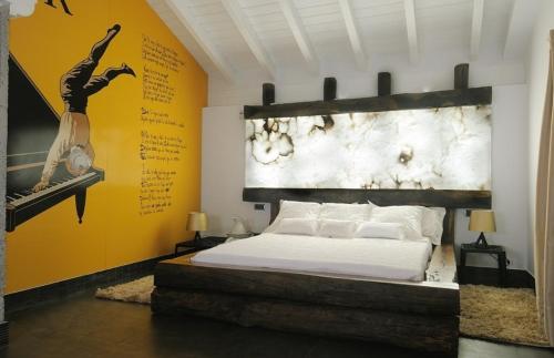 a bedroom with a bed and a painting on the wall at Hotel Aldori Landetxea - Reserva de la Biosfera Urdaibai - Adults Only in Muxika