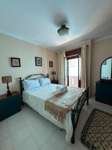 a bedroom with a bed and a window at Alvor Riverview in Alvor