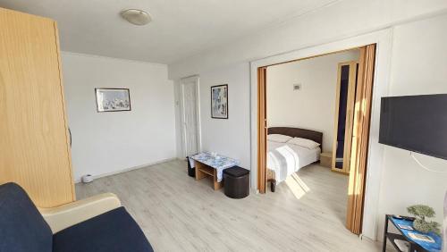 a hotel room with a bed and a mirror at To the Nerversea beach! in Constanţa