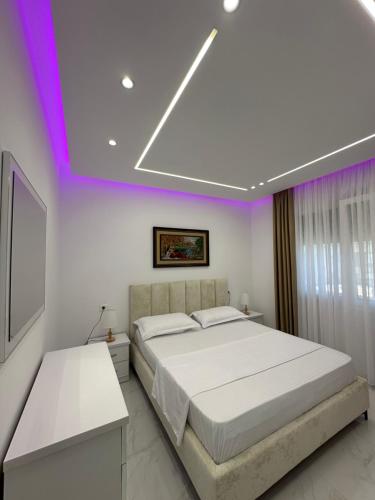 Giường trong phòng chung tại Gimi Apartments 4