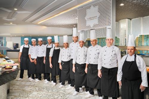 a group of chefs standing in a kitchen at Nahrawess Resort & Thalasso in Hammamet