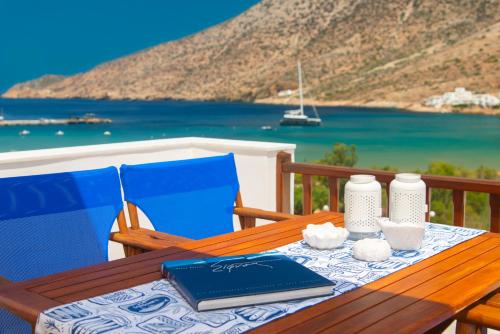 a wooden table with a book on top at Aggeliki's House in Kamarai