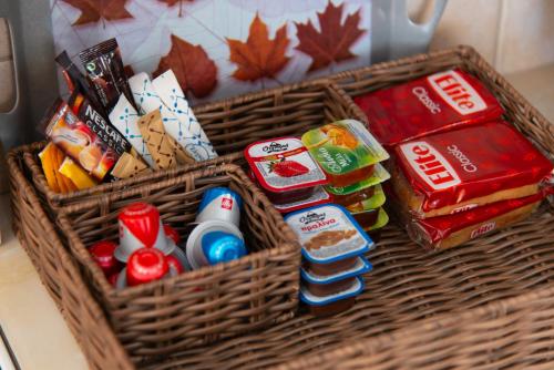 a basket filled with different types of food and drinks at Aggeliki's House in Kamarai