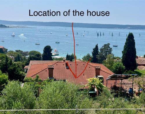 a house with a view of the water at Apartments Furlan in Portorož