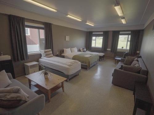 Rúm í herbergi á Ljosafoss Lake Guest House