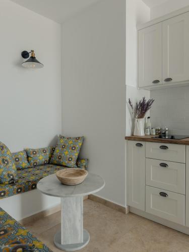 a living room with a table and a couch at VERANNA Patmos D4 in Patmos