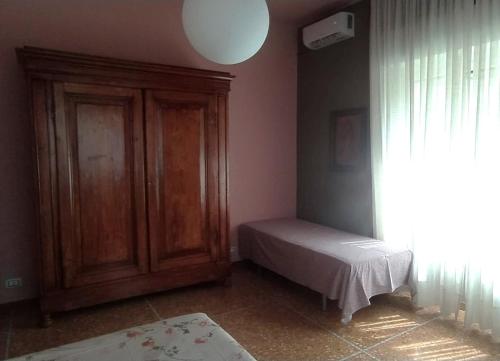 Postel nebo postele na pokoji v ubytování La casa di Giulia, trilocale con balcone e giardino