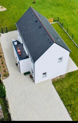 an overhead view of a white building with a black roof at Ker-Ysa Finistère in Plomodiern